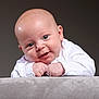 Freddie joined the competition — help win amazing prizes! baby, infant, smile, face, hands, white_clothing, cheeks, skin, portrait, cute, child, young, expression, head, background, resting, curious, human, studio, closeup