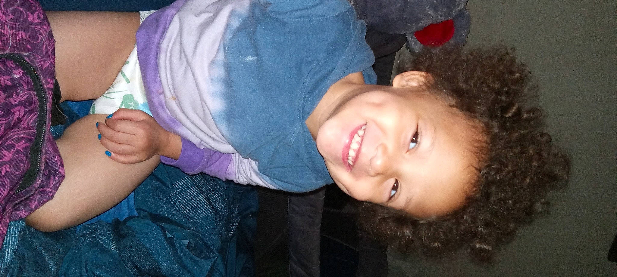 Nairah joined the competition — help win amazing prizes! baby, cheek, child, elbow, facial_expression, flash_photography, fun, gesture, grass, happy, joy, laugh, mouth, person, plant, portrait_photography, sitting, sleeve, smile, thumb