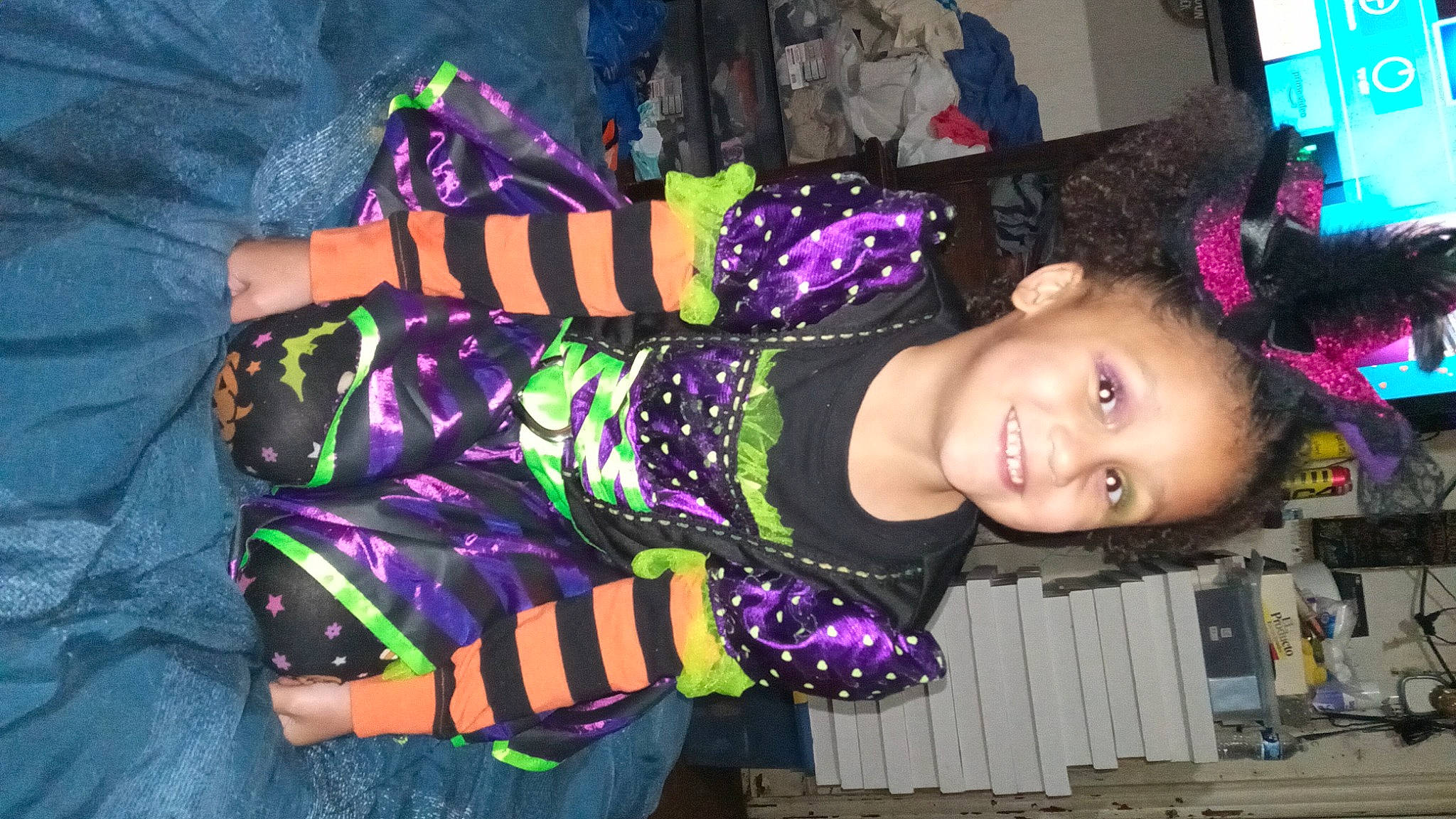 Emiliana is registered to the contest to win money with this photo: baby_toddler_clothing, child, event, fashion_accessory, fun, happy, joy, magenta, pattern, person, pink, purple, sleeve, smile, textile, toddler, violet