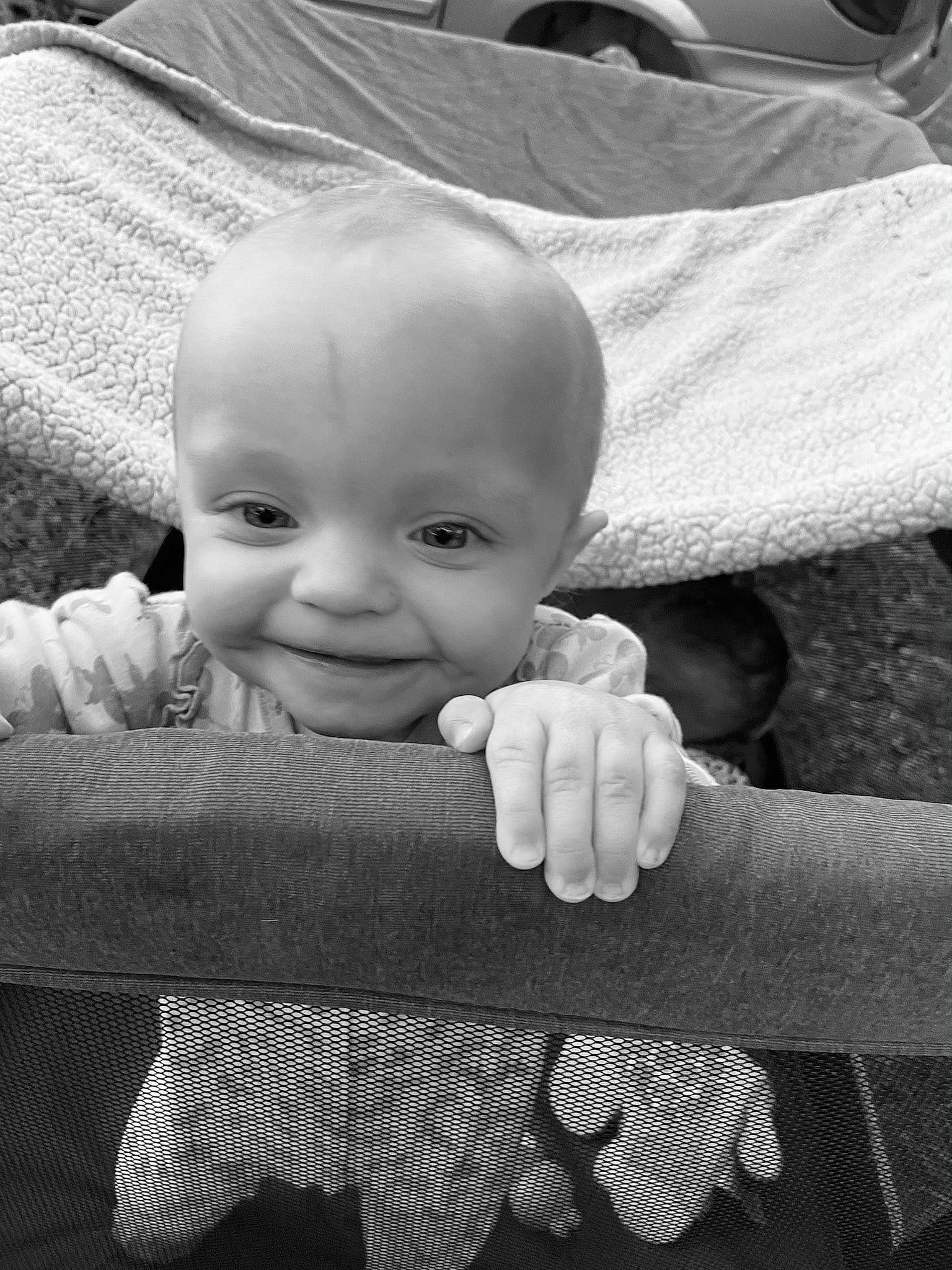 Alaina is registered to the contest to win money with this photo: arm, baby, black, black_and_white, cheek, chin, eye, eyebrow, face, finger, gesture, hand, happy, human, human_body, joy, mouth, nose, person, skin