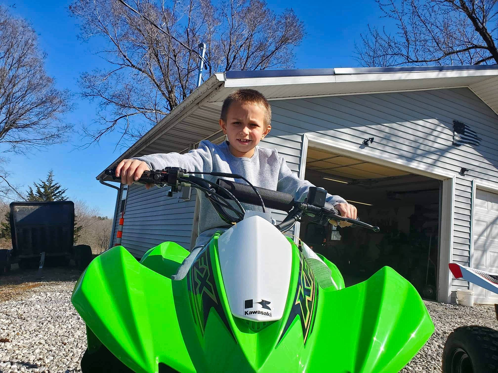 Dayton is registered to the contest to win money with this photo: automotive_design, automotive_exterior, automotive_lighting, automotive_tire, fender, grass, headlamp, leisure, motor_vehicle, motorcycle, motorcycle_accessories, motorcycle_fairing, motorcycling, person, personal_protective_equipment, rim, shade, sky, tree, vehicle