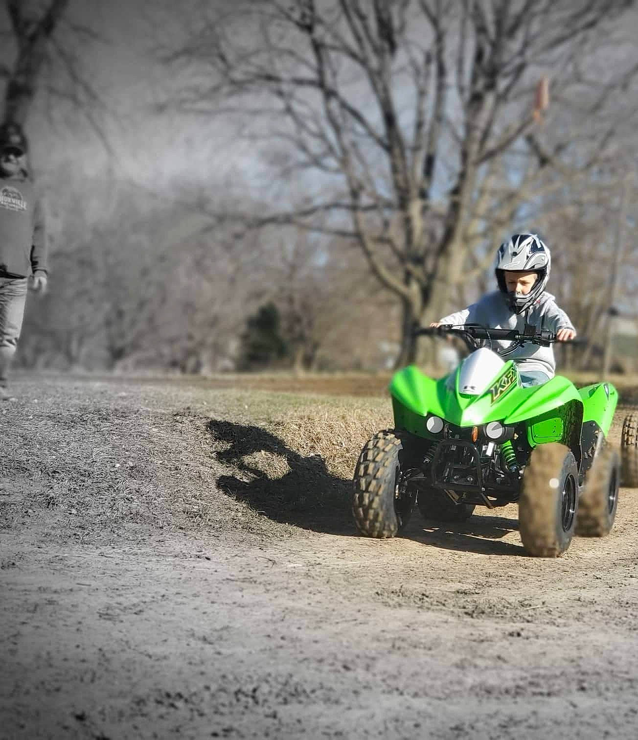 Dayton is registered to the contest to win money with this photo: automotive_design, automotive_tire, dirt_track_racing, enduro, fender, grass, headwear, helmet, motocross, motor_vehicle, motorcycle, motorcycling, off_road_racing, person, plant, sky, stunt_performer, tire, tread, tree