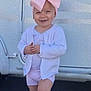 Laïzy a rejoint le concours — aidez-le/la à gagner de superbes lots ! baby_doll, casual_clothing, child, cute, daylight, doll, footwear, happy, knee_high_socks, metal_background, outdoor, person, pink_bow, playtime, shorts, smiling, standing, toddler, toy_stroller, white_cardigan