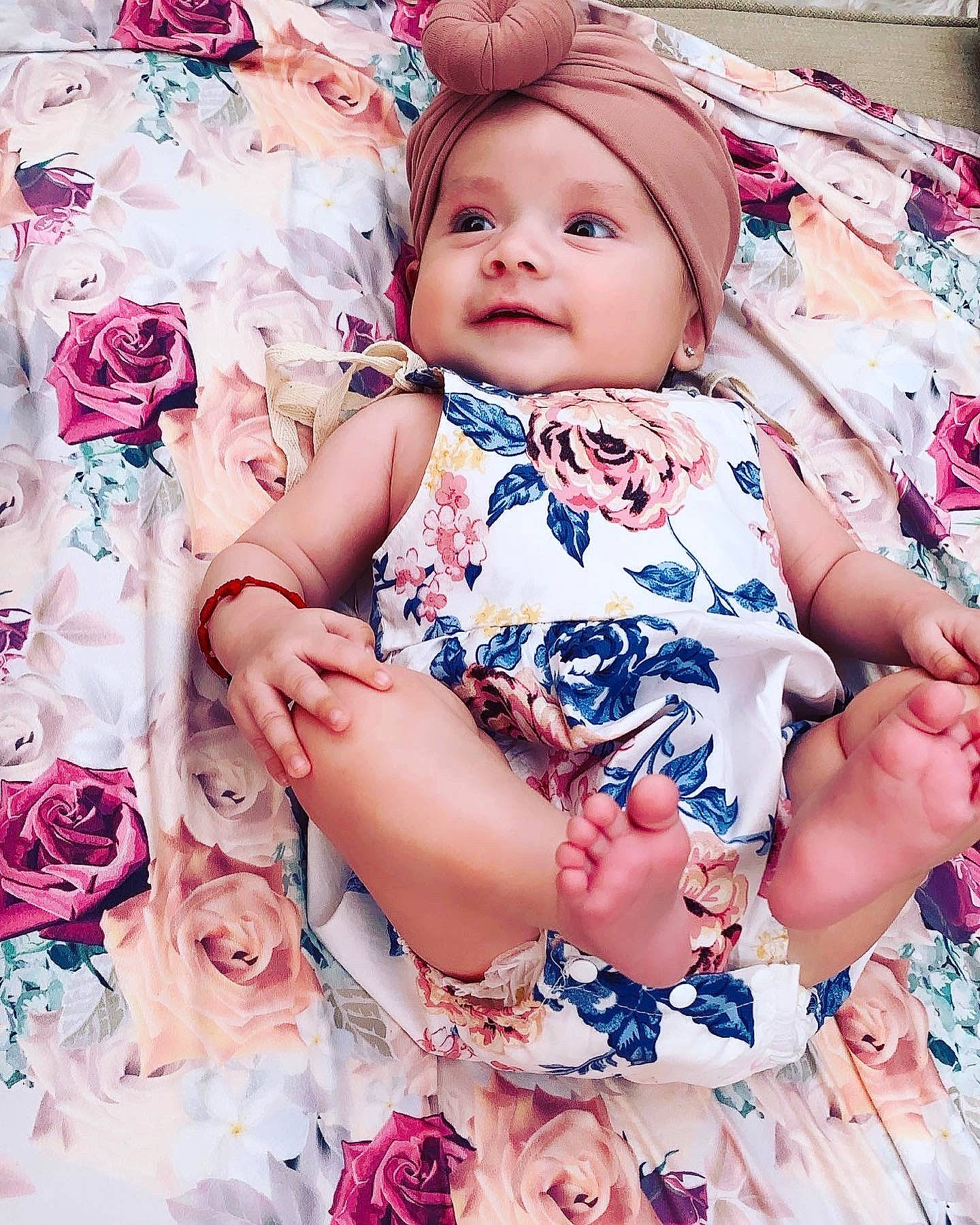 Zoe is registered to the contest to win money with this photo: arm, baby, baby_toddler_clothing, cheek, dress, eye, eyelash, facial_expression, fashion, hand, happy, headwear, iris, person, photograph, pink, product, skin, sleeve, textile