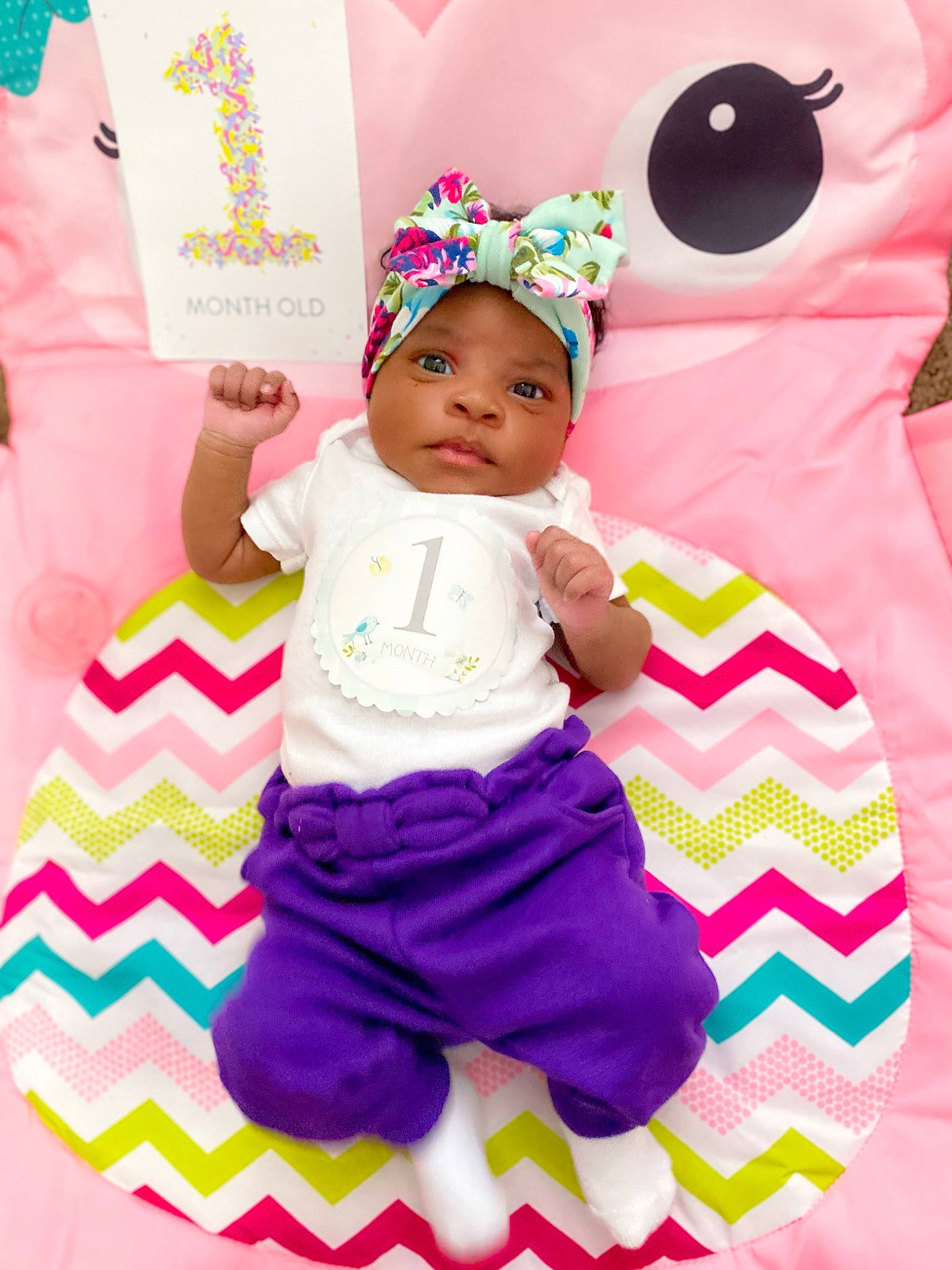 Amora is registered to the contest to win money with this photo: baby, baby_products, baby_toddler_clothing, child, clothing, fun, green, happy, headwear, linens, magenta, pattern, person, pink, purple, sleeve, t_shirt, textile, toddler, violet