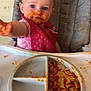 toddler, child, high_chair, messy, spaghetti_sauce, food, plate, pink_clothing, bib, reaching_hand, face, blue_eyes, hair, indoor, feeding, meal_time, curious, expression, baby_food, seat