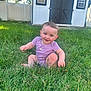 baby, child, grass, backyard, shed, purple_onesie, smiling, happy, outdoor, sunlight, greenery, nature, summer, sitting, cute, infant, person, face, grass_blades, daylight