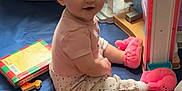 Sunny joined the competition — help win amazing prizes! baby, child, indoor, toys, book, headband, pink, slippers, playtime, floor, crawling, cute, smiling, girl, colorful, plastic, soft, clothing, person, portrait