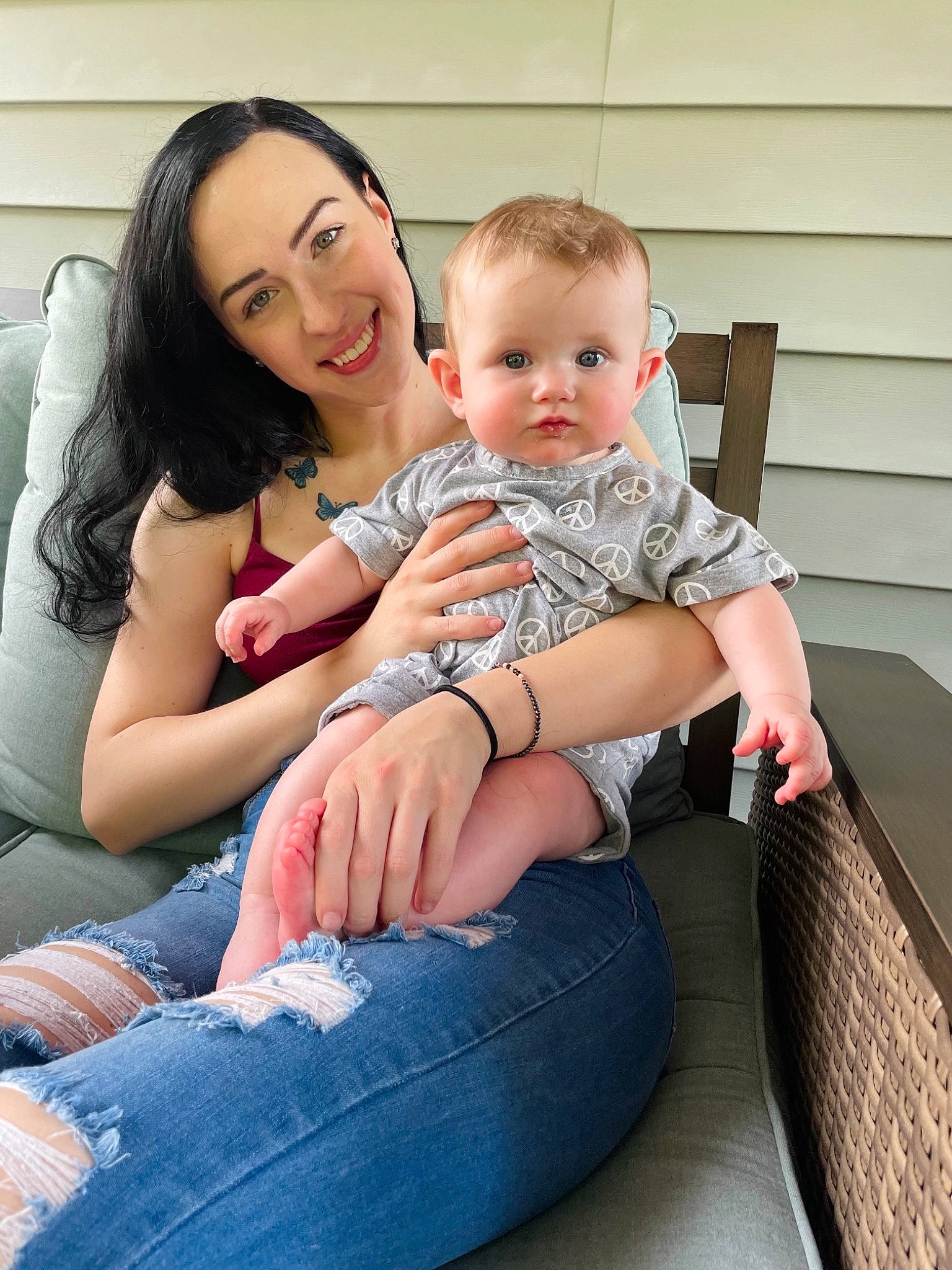 River is registered to the contest to win money with this photo: baby, child, clothing, comfort, couch, face, finger, flash_photography, happy, head, human_body, joint, joy, lap, leg, leisure, person, shoulder, skin, t_shirt