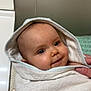 baby, towel, hood, smile, face, child, wrapped, soft, cute, infant, hand, indoor, blanket, cozy, person, portrait, skin, eyes, expression, newborn