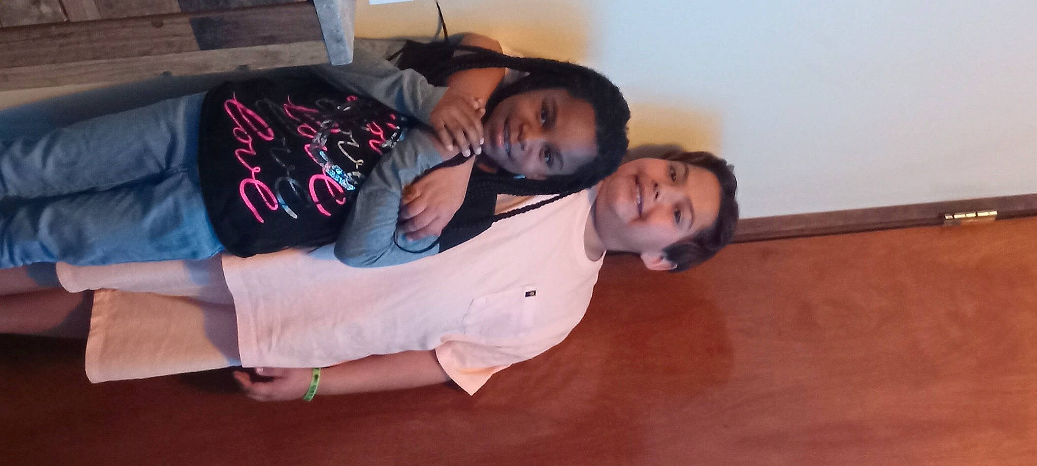 Samuel is registered to the contest to win money with this photo: child, comfort, elbow, event, face, flooring, formal_wear, fun, happy, hardwood, joy, person, room, sitting, sleeve, smile, toddler, wood