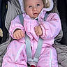 Margaux participe au concours pour gagner de l'argent avec cette photo : baby, blue_eyes, buckle, car_seat, cheeks, child, close_up, cozy, cute, eyelashes, fabric, hands, harness, hood, infant, pink_snowsuit, portrait, sitting, stroller, zipper