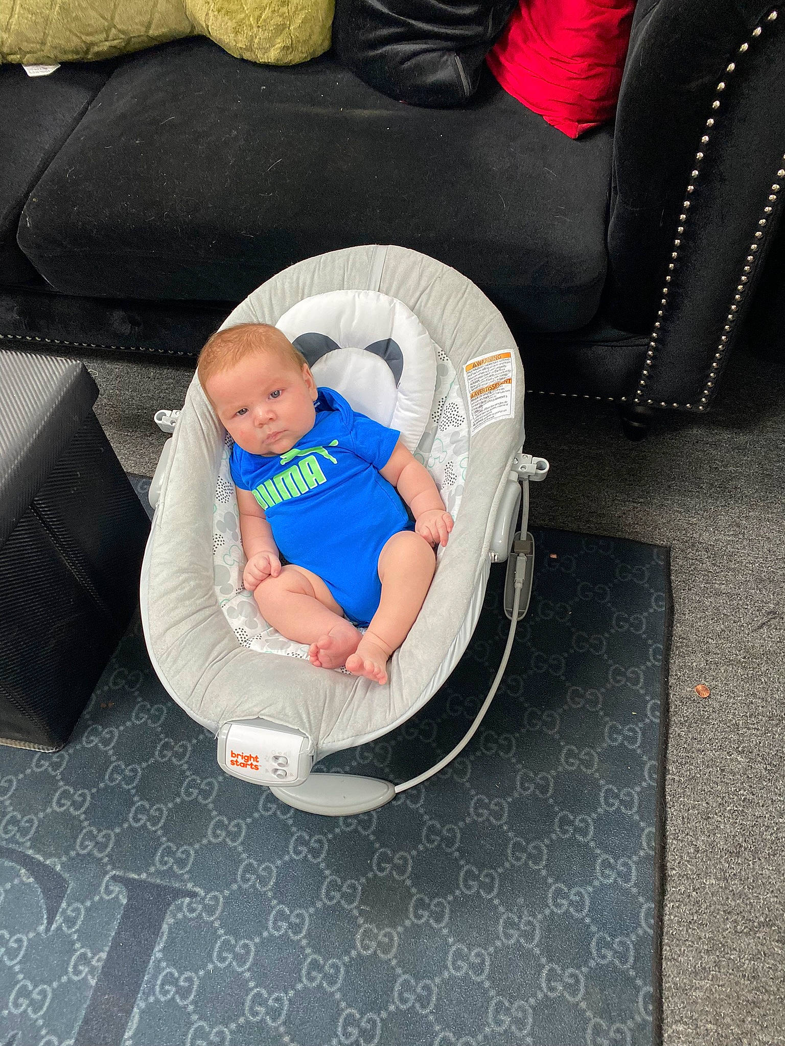 Gilbert is registered to the contest to win money with this photo: auto_part, baby, baby_carriage, baby_products, baby_safety, baby_sleeping, baby_toddler_clothing, bag, car_seat, chair, child, comfort, fashion_accessory, flooring, infant_bed, lap, luggage_and_bags, person, sitting, thigh