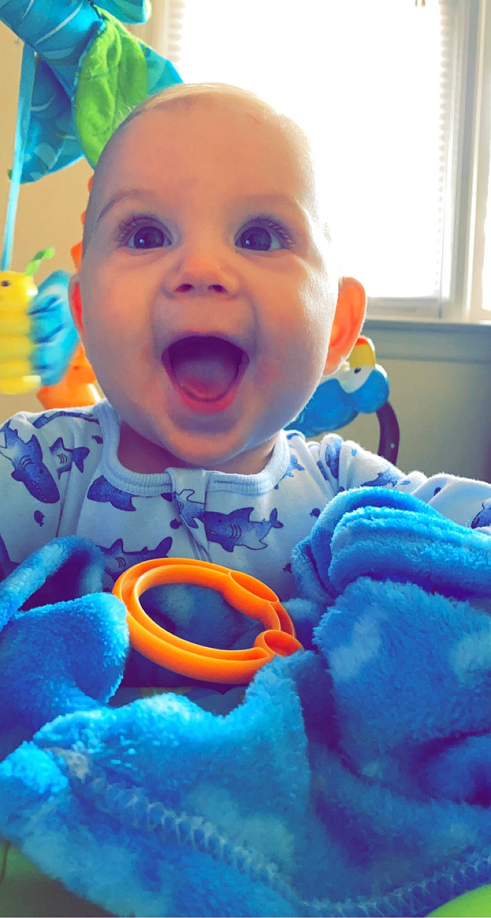 Kashtyn joined the competition — help win amazing prizes! baby, baby_laughing, baby_toddler_clothing, blue, cheek, eye, face, facial_expression, happy, head, iris, mouth, nose, orange, person, purple, skin, smile, textile, window