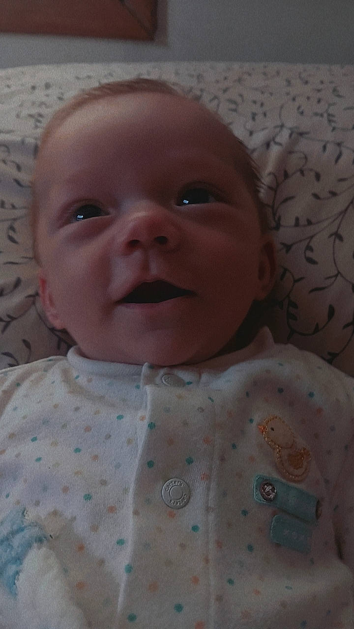 Rowan joined the competition — help win amazing prizes! baby, baby_toddler_clothing, cheek, child, chin, comfort, face, happy, head, iris, linens, lip, nose, pattern, person, pink, skin, sleeve, smile, textile