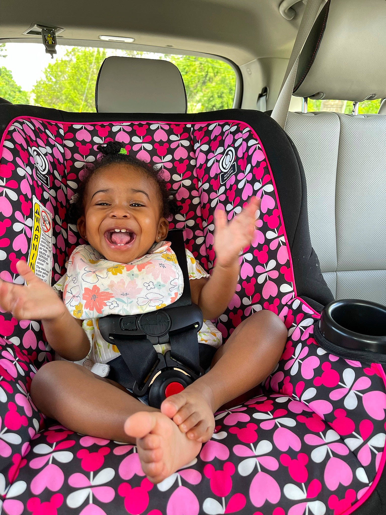 Heavenly is registered to the contest to win money with this photo: auto_part, automotive_design, automotive_exterior, baby_toddler_clothing, black, car, car_seat, car_seat_cover, comfort, dress, fun, happy, head_restraint, leisure, motor_vehicle, person, pink, smile, toddler, vehicle_door