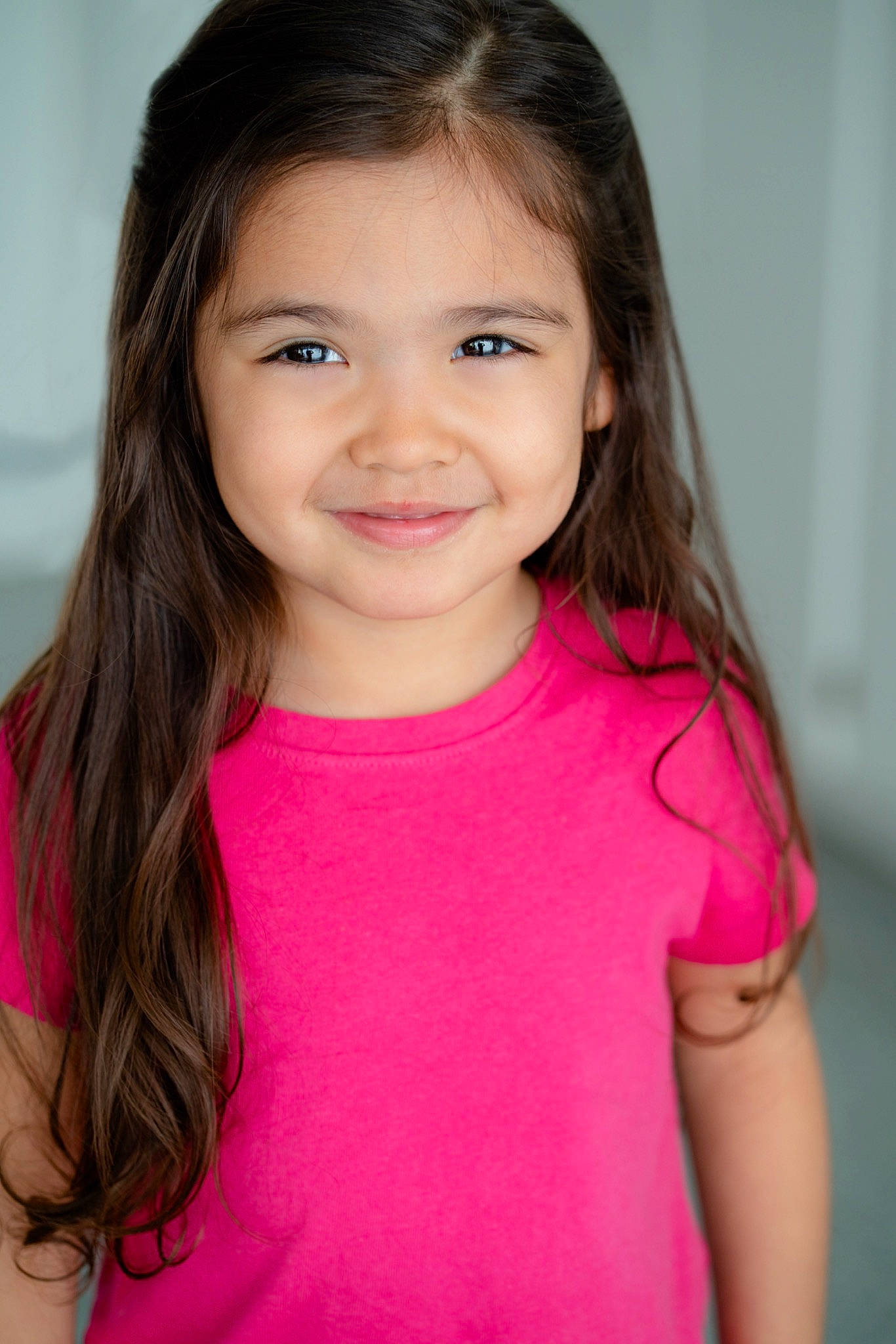 Mia Campos is registered to the contest to win money with this photo: beauty, brown_hair, cheek, child, child_model, chin, face, hair, hairstyle, joy, lip, long_hair, magenta, neck, person, photography, pink, skin, smile, t_shirt