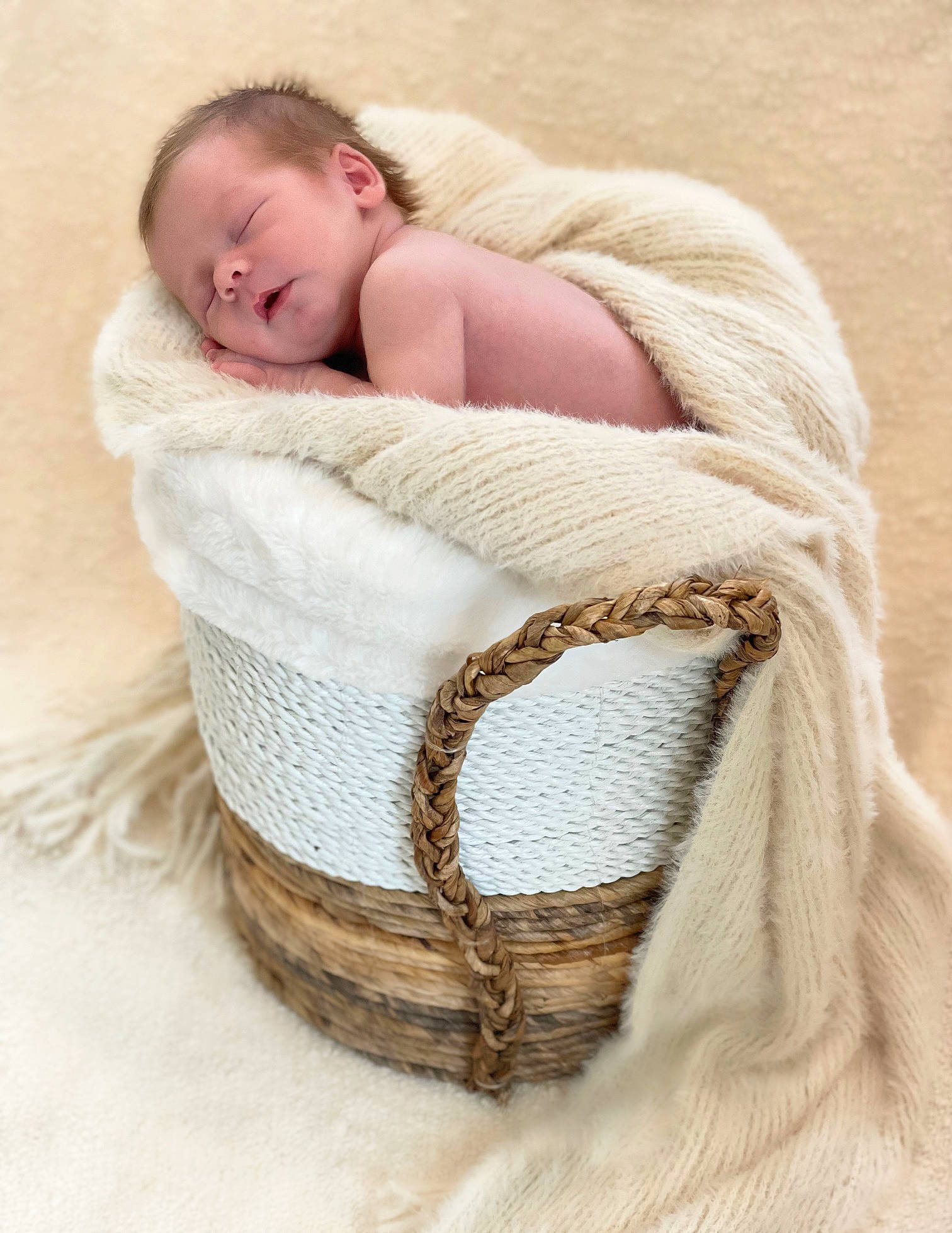 Jaden is registered to the contest to win money with this photo: baby, baby_products, baby_safety, baby_sleeping, baby_toddler_clothing, basket, chair, child, comfort, fashion_accessory, fur, headgear, human_body, infant_bed, linens, person, toddler, wicker, wood, wool