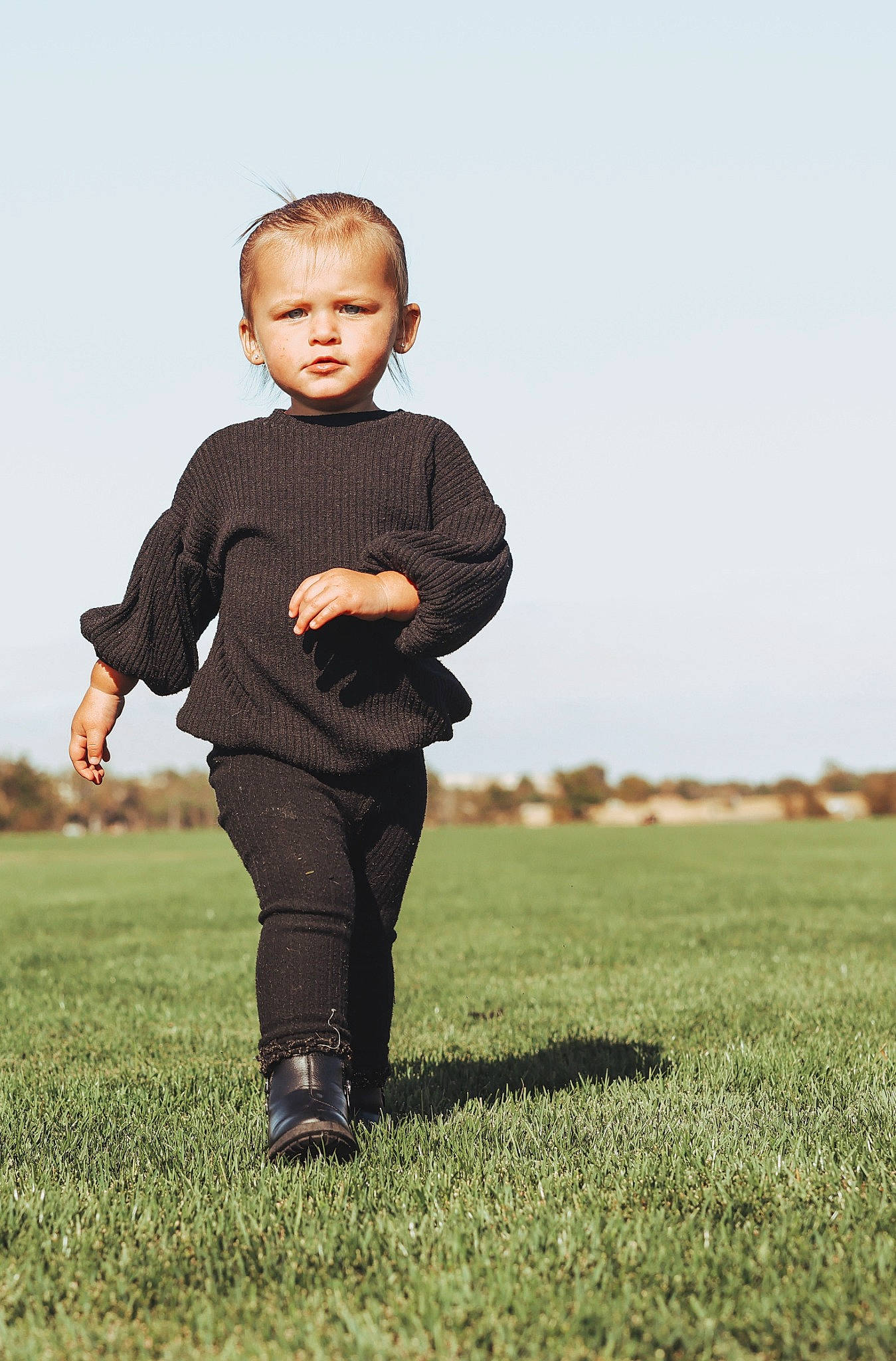 Audrina is registered to the contest to win money with this photo: agriculture, baby, baby_toddler_clothing, ball, child, flash_photography, fun, gesture, grass, grassland, happy, landscape, pasture, people_in_nature, person, plant, prairie, sitting, sky, sleeve