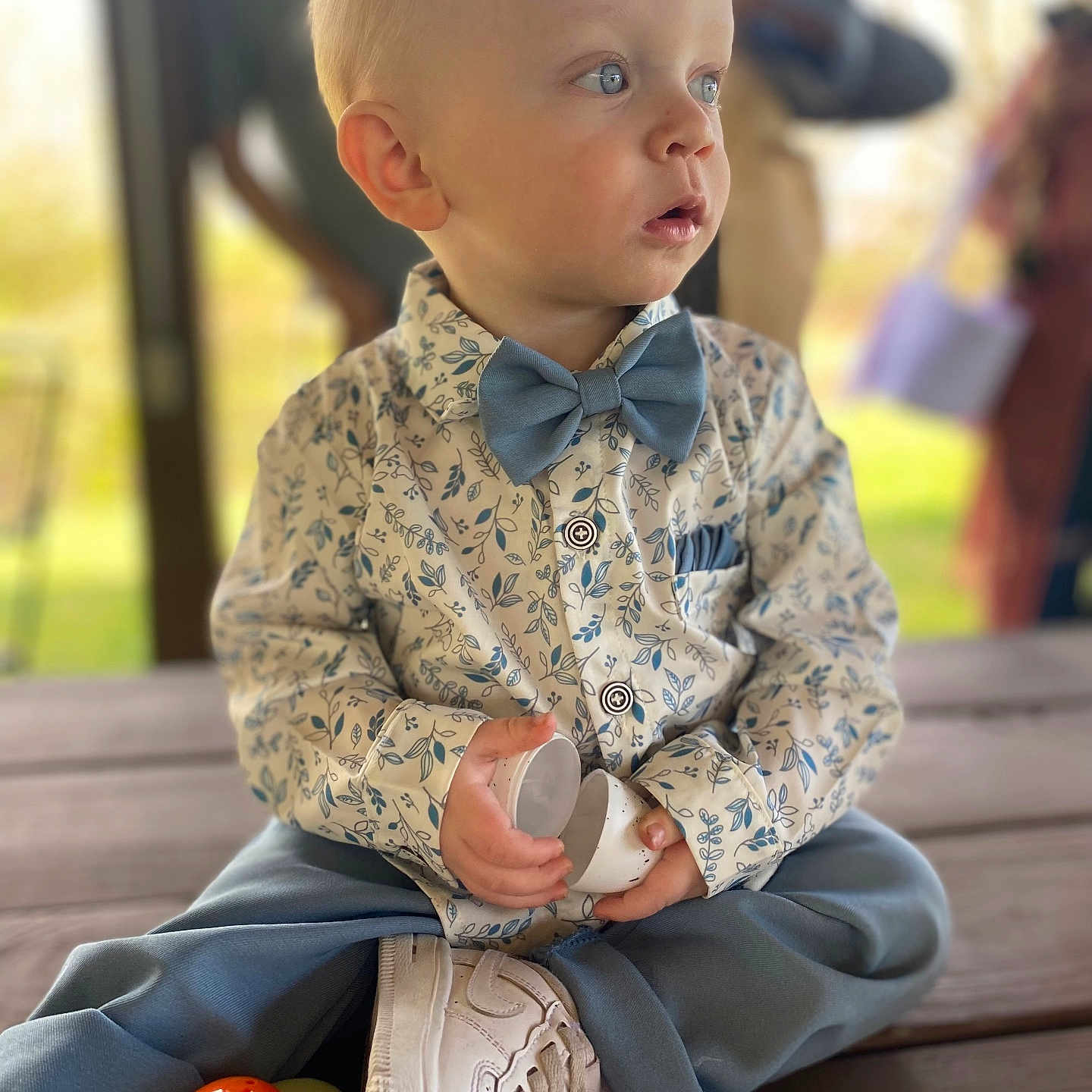 August is registered to the contest to win money with this photo: accessories, baby, boy, child, clothing, coat, dress, face, footwear, formalwear, head, male, pants, person, photography, portrait, shirt, shoe, sitting, tie