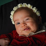 Jannah participe au concours pour gagner de l'argent avec cette photo : adorable, baby, child, closeup, cute, dark_background, expression, face, fingers, flower_headband, happy, head, infant, newborn, person, portrait, red_clothing, smile, soft_lighting, young