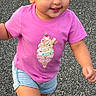 Nathalie joined the competition — help win amazing prizes! toddler, child, pink_shirt, ice_cream_graphic, shorts, sneakers, outdoor, asphalt, walking, happy, smiling, girl, casual_clothing, playful, cute, young_child, summer, daytime, person, motion