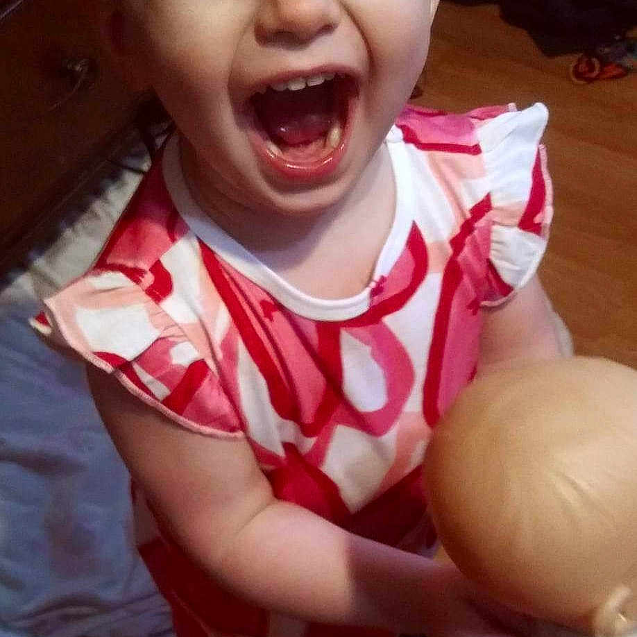 Avery joined the competition — help win amazing prizes! baby, ball, bodypart, clothing, dress, face, football, footwear, happy, head, laughing, mouth, person, photography, portrait, soccer, soccerball, sport, t_shirt, teeth