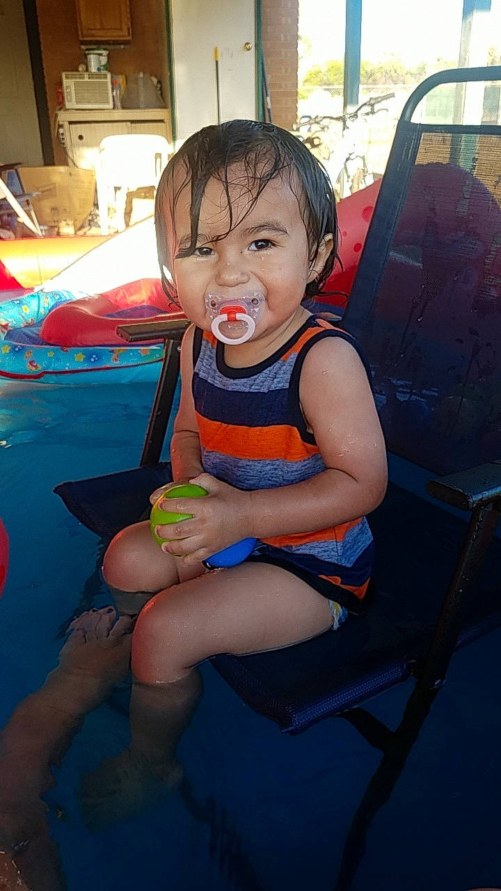 Zedakiah is registered to the contest to win money with this photo: baby, child, fun, leg, leisure, person, play, sitting, skin, smile, toddler, vacation