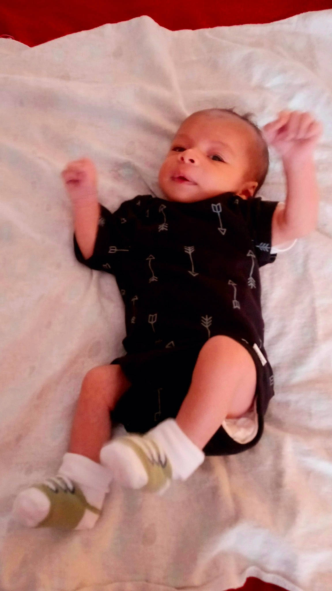 Deshaun joined the competition — help win amazing prizes! baby, baby_products, baby_toddler_clothing, cheek, child, comfort, eye, foot, head, human_leg, knee, leg, pattern, person, pink, sitting, skin, sleeve, sock, thigh