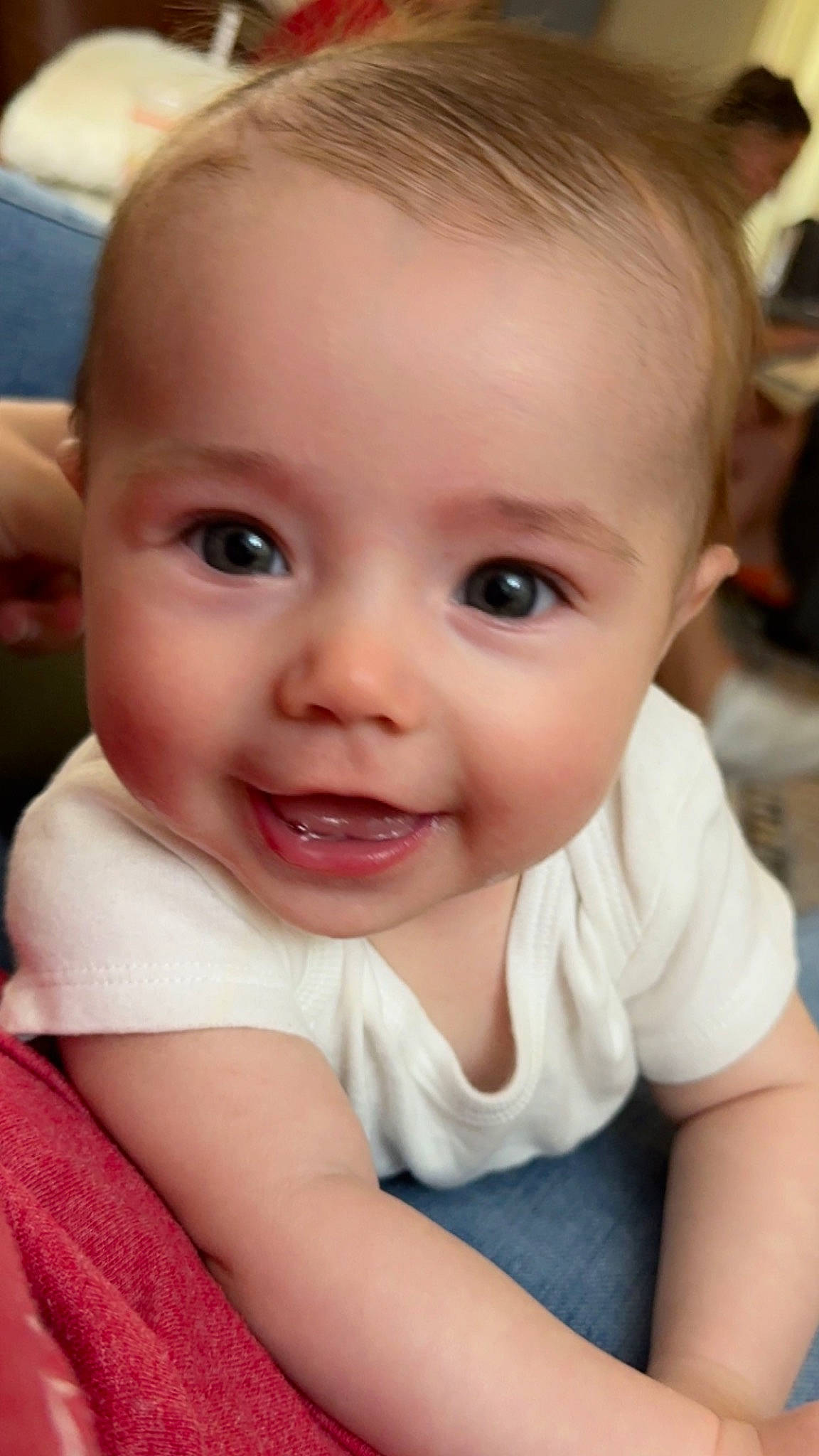 Blakely is registered to the contest to win money with this photo: baby, cheek, chin, ear, eyebrow, eyelash, flash_photography, forehead, gesture, happy, iris, joy, lip, mammal, mouth, neck, nose, person, skin, sleeve