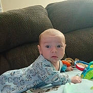 Liam joined the competition — help win amazing prizes! alert, baby, blanket, child, clothing, colorful, comfortable, couch, cute, expression, face, furniture, indoor, infant, person, play, soft, toy, tummy_time, young