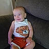 Liam joined the competition — help win amazing prizes! arm, baby, bear_print, child, clothing, couch, face, furniture, happy, head, home, indoors, leg, person, shorts, sitting, skin, smile, tank_top, toddler