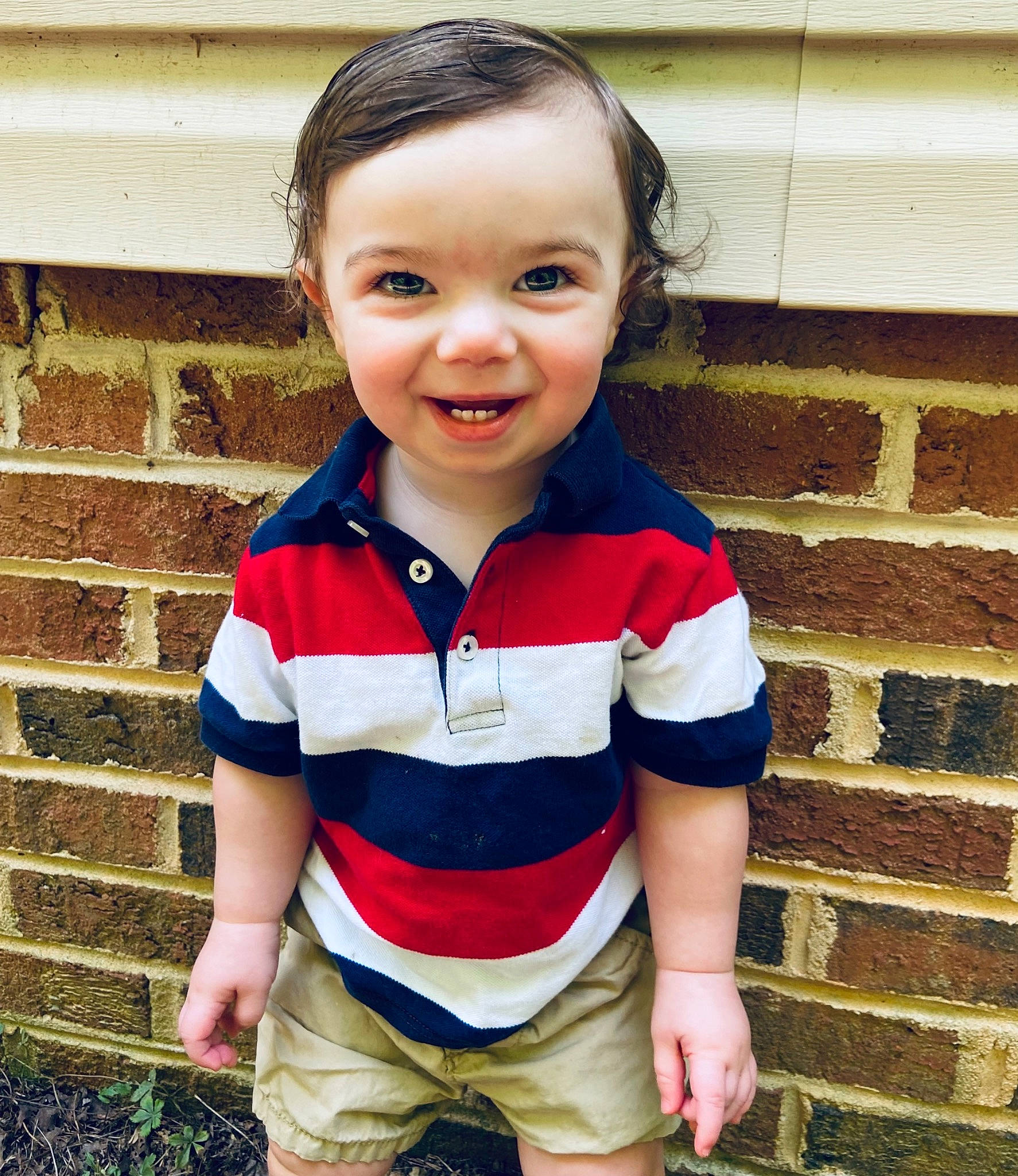 Waylon is registered to the contest to win money with this photo: arm, baby, baby_toddler_clothing, child, clothing, electric_blue, eye, face, fun, grass, happy, head, headgear, joy, neck, person, personal_protective_equipment, sleeve, smile, standing