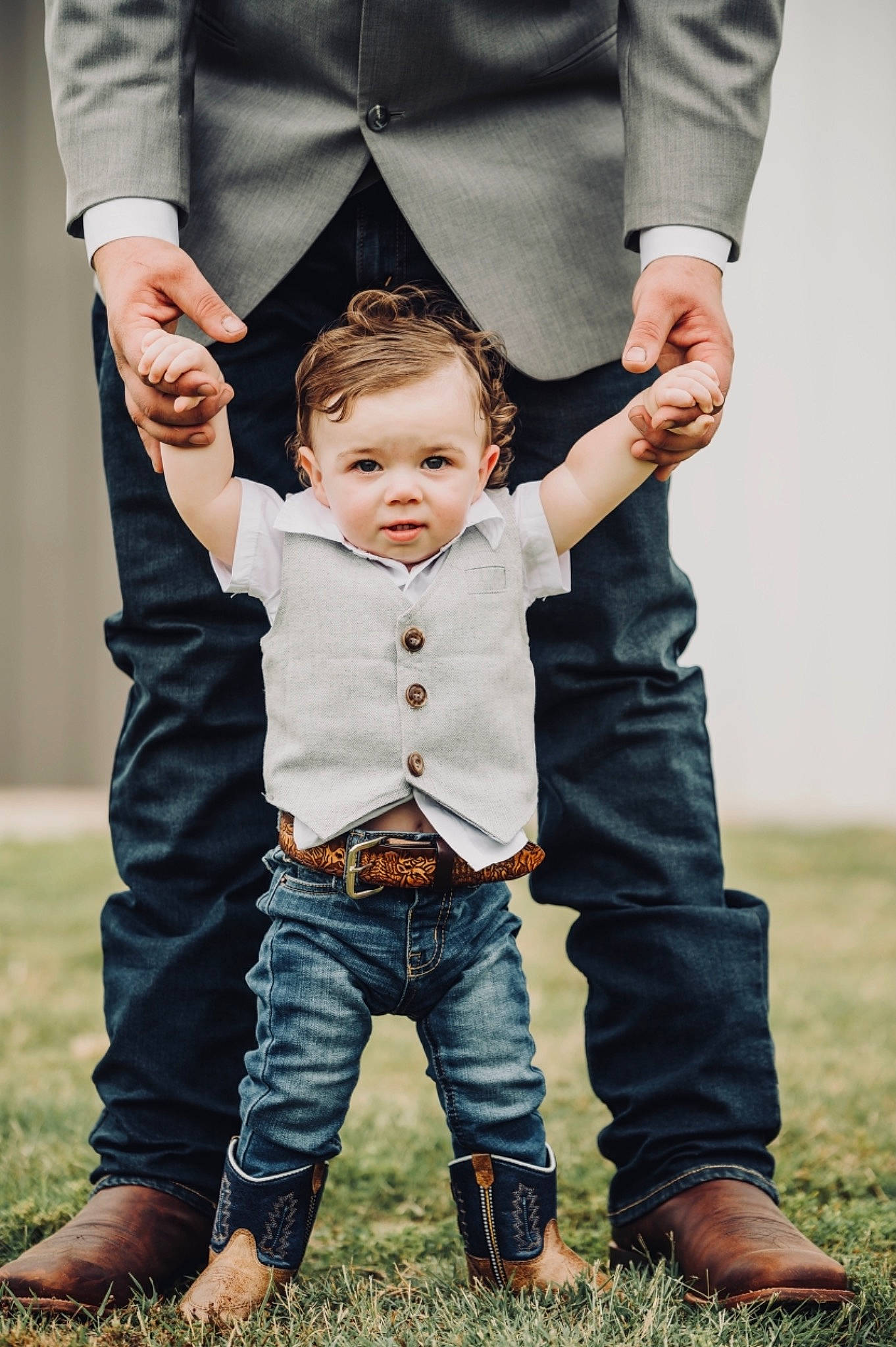 Waylon is registered to the contest to win money with this photo: baby, clothing, eye, face, flash_photography, fun, gesture, grass, hand, happy, head, holding_hands, human, human_body, leg, outerwear, people_in_nature, person, standing, toddler