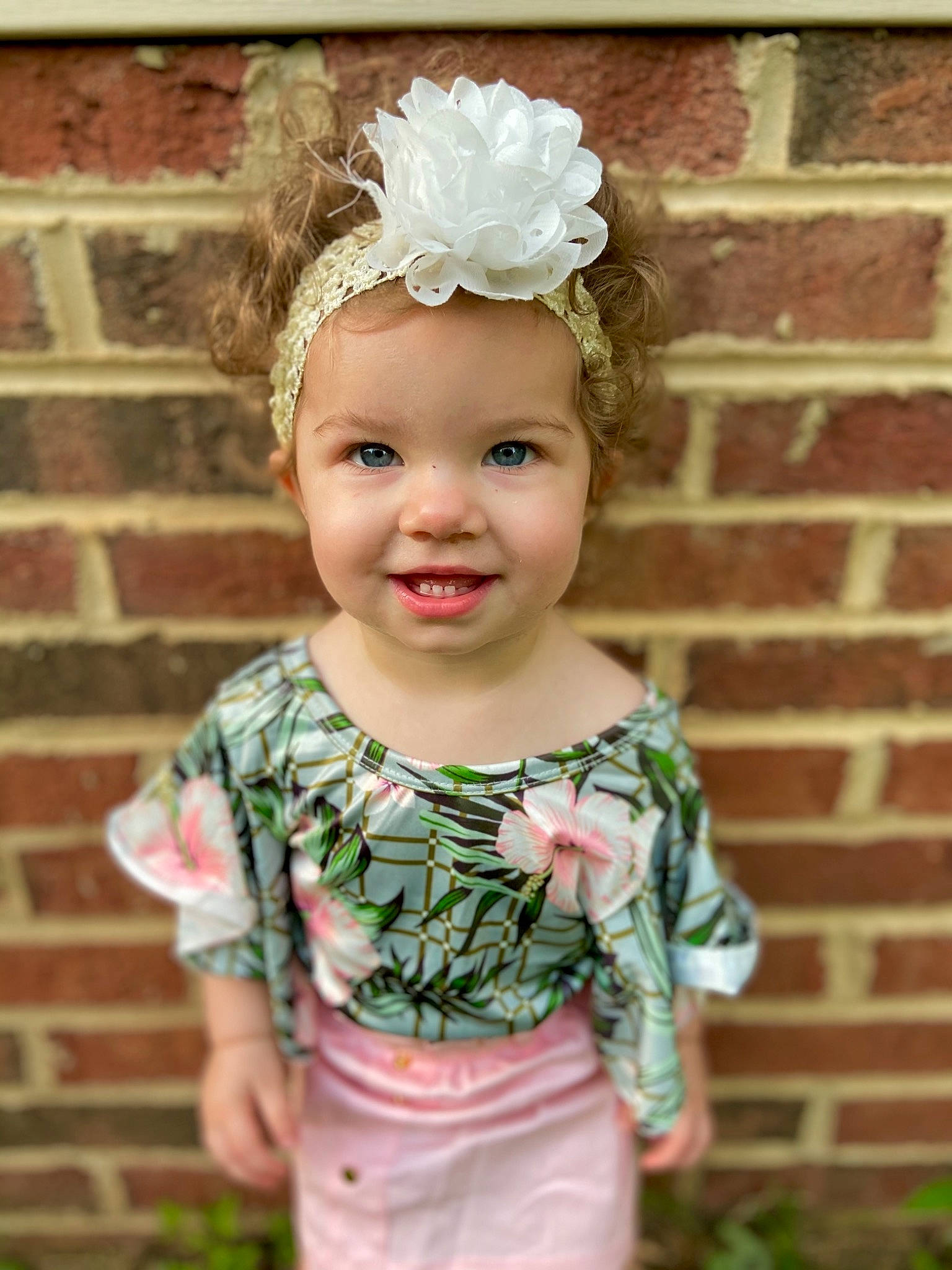 Rylie joined the competition — help win amazing prizes! baby_toddler_clothing, child, chin, clothing, eye, face, flash_photography, flower, grass, happy, head, headband, headpiece, headwear, iris, joy, person, pink, plant, skin