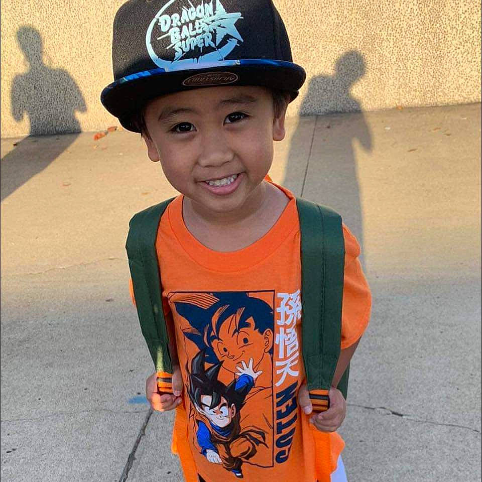 Jo Aizen is registered to the contest to win money with this photo: baby_toddler_clothing, baseball_cap, cap, child, costume_hat, electric_blue, fashion_accessory, fun, happy, hat, head, headgear, headwear, joy, pattern, person, personal_protective_equipment, sleeve, smile, t_shirt