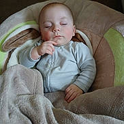 Vincent is registered to the contest to win money with this photo: baby, blanket, bouncer, cheeks, closed_eyes, cozy, cute, face, hand, head, homedecor, indoor, infant, napping, onesie, peaceful, plush, portrait, sleeping, soft_fabric