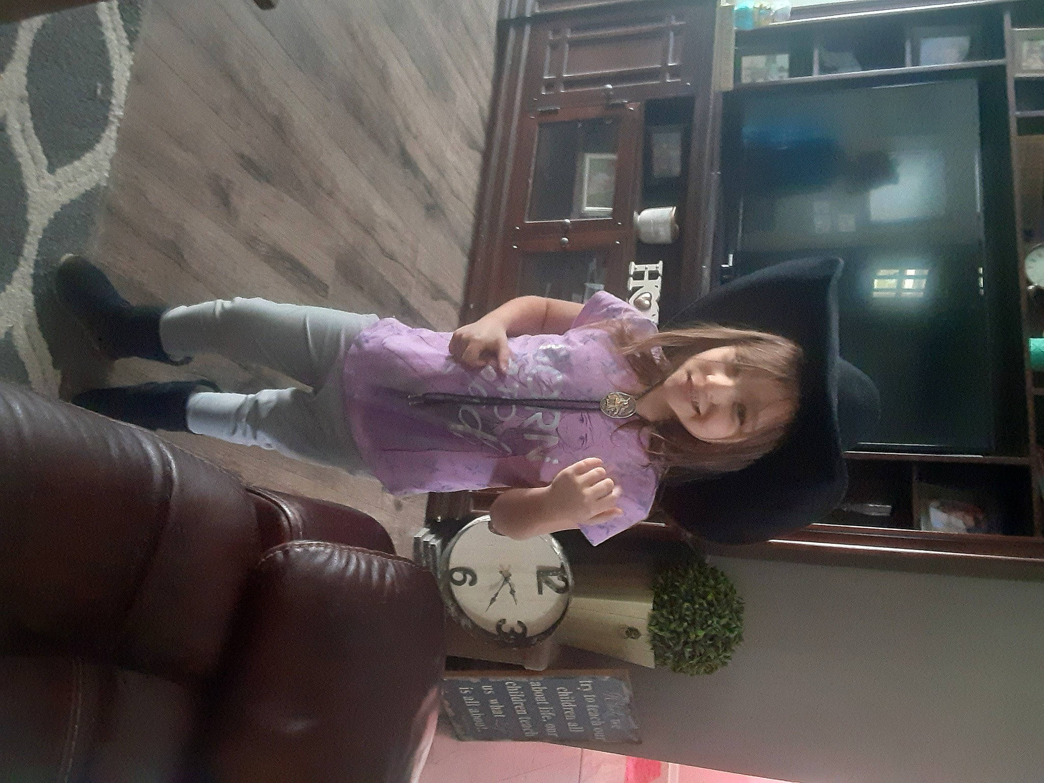 Zendaya is registered to the contest to win money with this photo: display_device, fun, gesture, glove, human_leg, joy, luxury_vehicle, machine, magenta, person, plant, purple, room, smile, television_set, thigh, transport