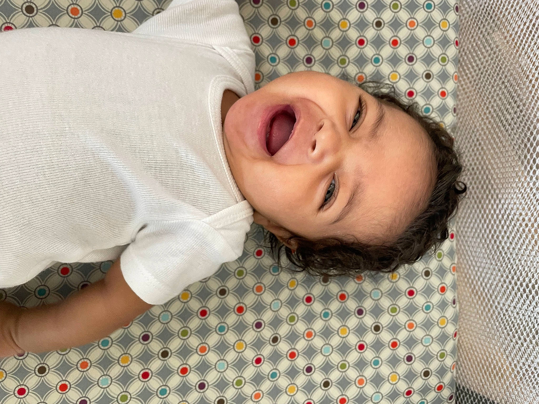 Avayah is registered to the contest to win money with this photo: baby, baby_toddler_clothing, bedding, cheek, child, comfort, eyelash, flooring, happy, linens, lip, nose, pattern, person, plaid, portrait_photography, sleeve, smile, textile, toddler