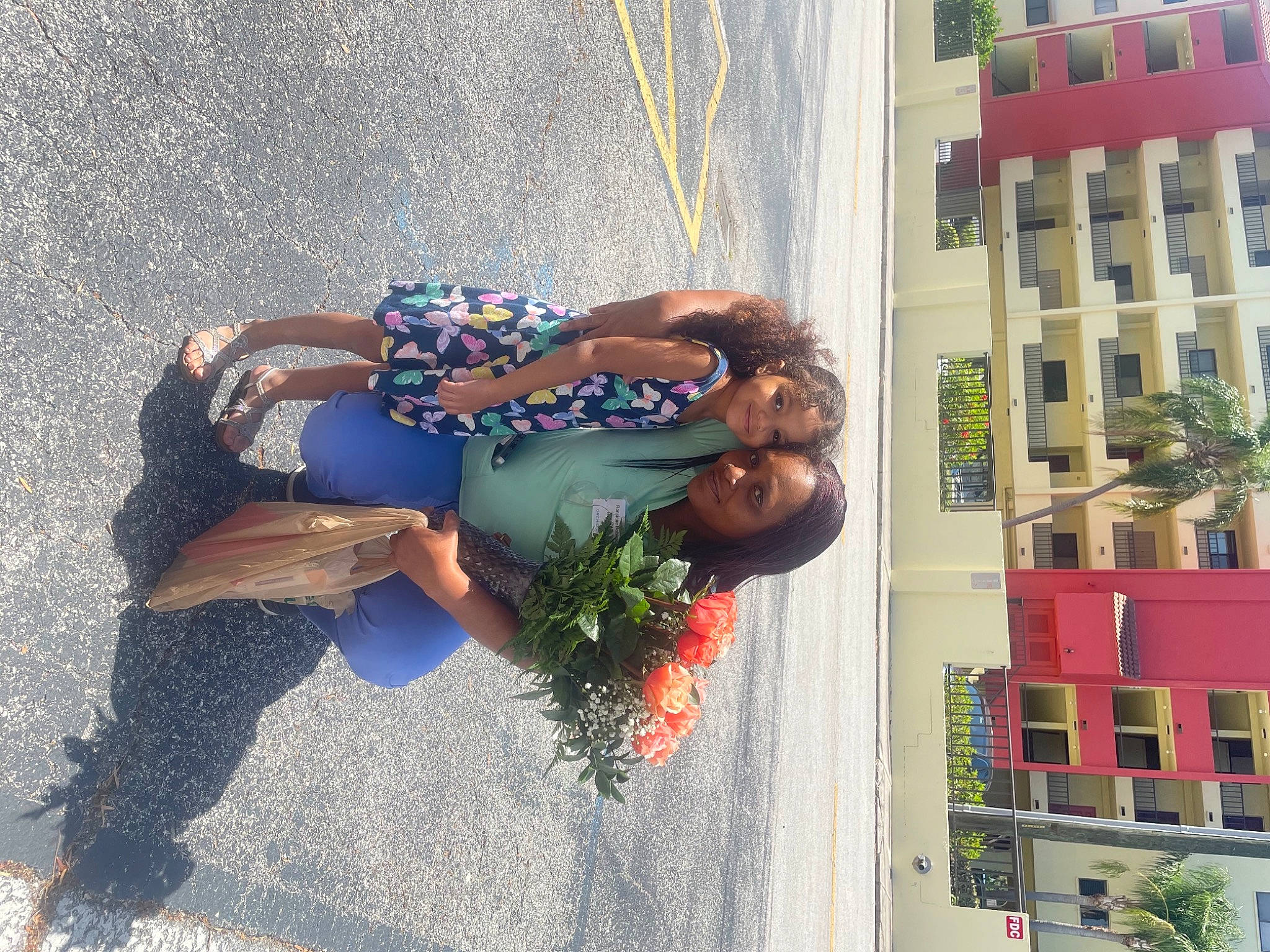 Melodie is registered to the contest to win money with this photo: building, city, denim, dress, facade, fun, human_leg, joy, leisure, person, plant, shadow, sidewalk, smile, street, street_fashion, thigh, tourism, tree, vacation