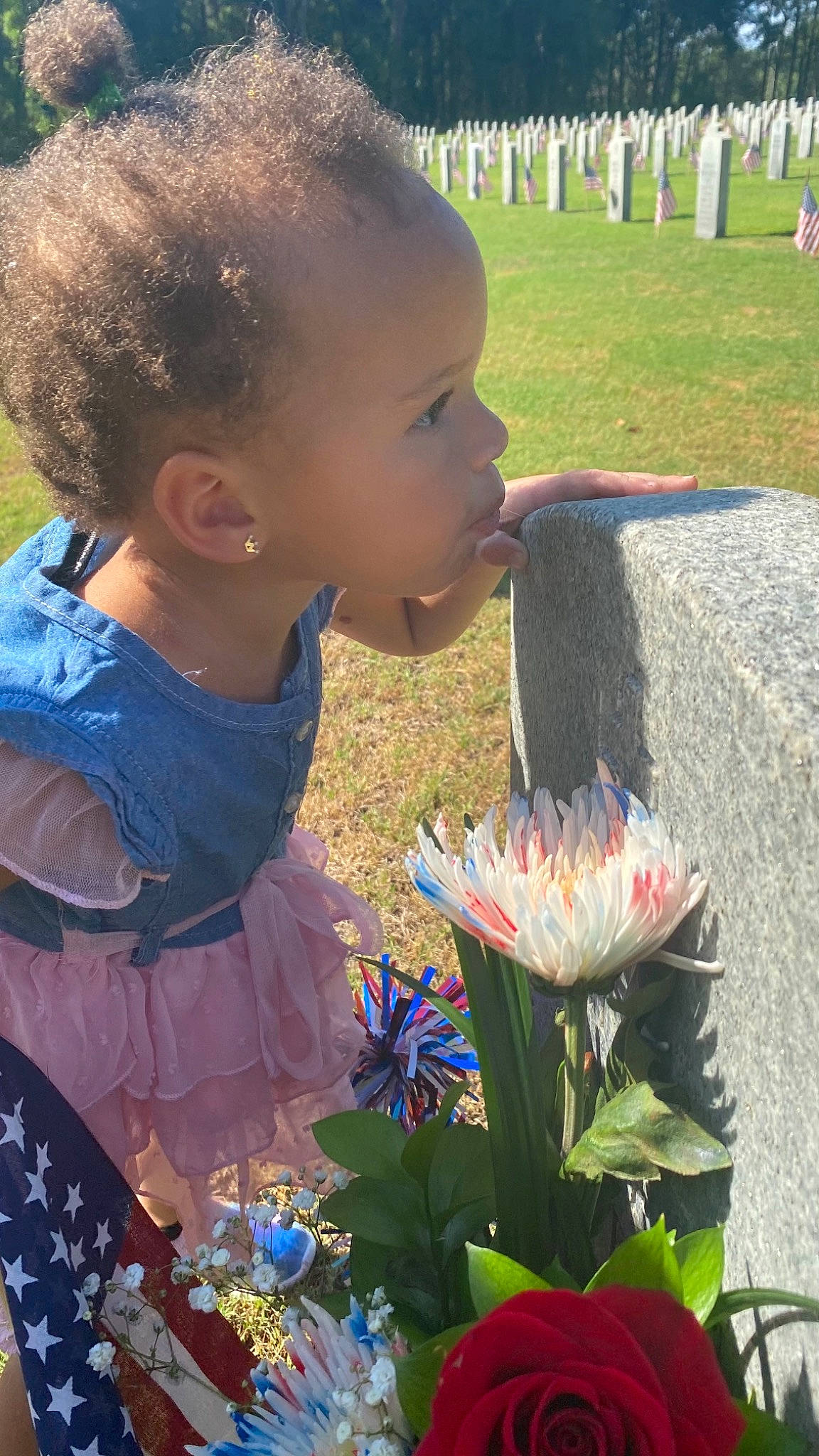 Rilynn is registered to the contest to win money with this photo: baby_toddler_clothing, botany, child, face, flower, fun, grass, grass_family, green, happy, head, iris, leaf, organ, people, person, petal, photograph, plant, summer