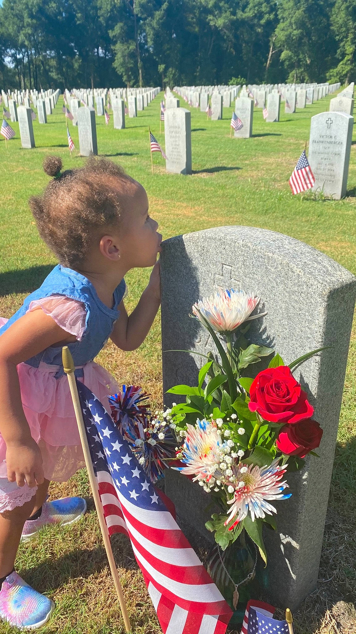 Rilynn joined the competition — help win amazing prizes! annual_plant, botany, bouquet, cemetery, community, event, flag_of_the_united_states, flower, flower_arranging, grass, grass_family, grave, person, petal, photograph, plant, rose, shorts, spring, summer