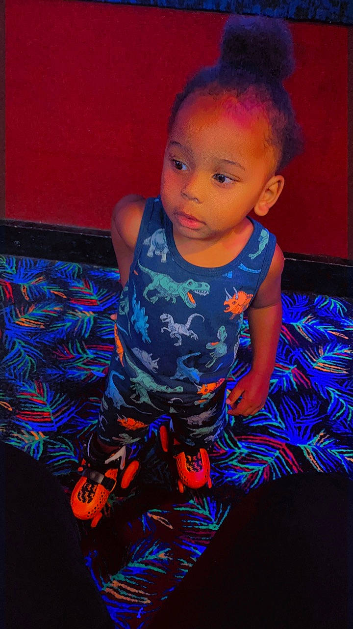 Darius is registered to the contest to win money with this photo: baby, baby_toddler_clothing, blue, child, electric_blue, fashion_design, flash_photography, floor, flooring, fun, happy, head, iris, magenta, pattern, person, purple, sleeve, t_shirt, toddler
