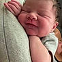 Mariana is registered to the contest to win money with this photo: baby, newborn, sleeping, smiling, face, hand, skin, person, resting, cute, infant, soft, comfort, peaceful, closeup, indoors, human, portrait, cuddle, relaxation