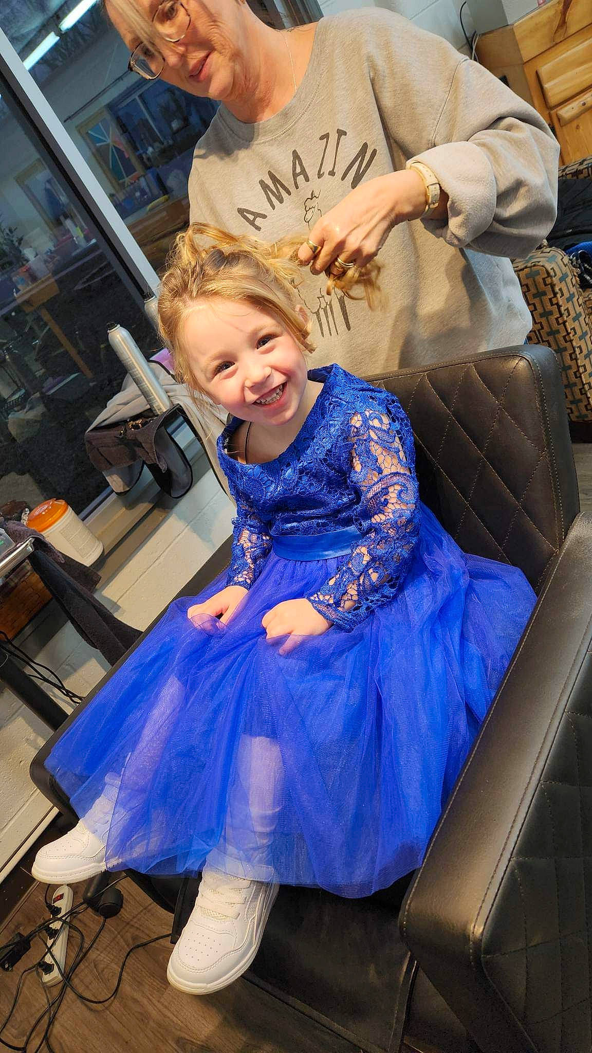 Aiyanna is registered to the contest to win money with this photo: blue, chair, child, electric_blue, event, fashion_design, formal_wear, fun, gown, hairstyle, happy, joy, leisure, magenta, people, person, purple, sandal, sitting, smile