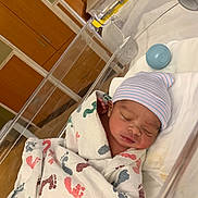 Keemaya joined the competition — help win amazing prizes! architecture, baby, bed, blanket, building, childbirth, clothing, crib, face, furniture, head, hosiery, hospital, indoors, infantbed, newborn, person, photography, portrait, sock