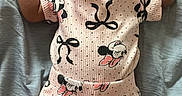 Kahlani joined the competition — help win amazing prizes! baby, baby_girl, bows, casual, child, clothing, comfortable, cute, indoors, infant, lying_down, mickey_mouse_pattern, pacifier, pink_outfit, portrait, relaxed, resting, sleepwear, small_hands, soft_surface