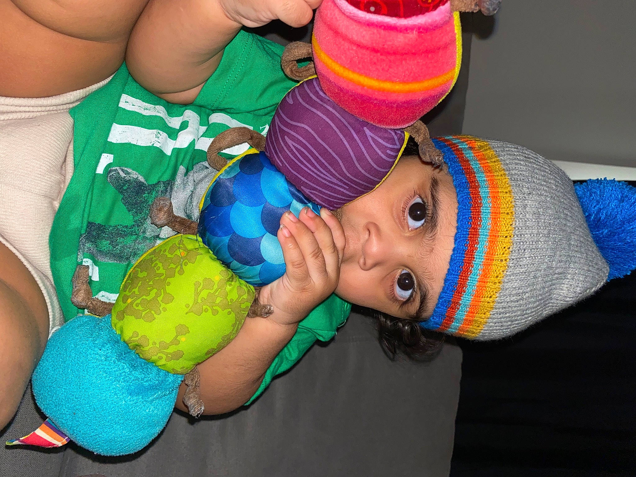 Zakai is registered to the contest to win money with this photo: baby, beanie, cap, chest, child, electric_blue, fashion_accessory, fun, happy, headgear, headwear, knit_cap, nail, party_supply, pattern, person, personal_protective_equipment, plastic, textile, toddler