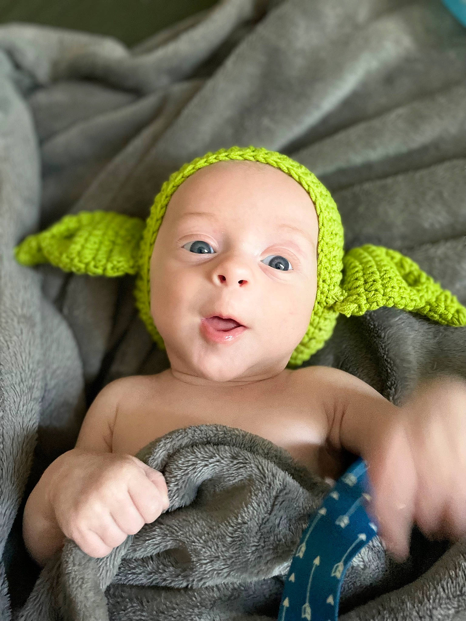 Colton is registered to the contest to win money with this photo: baby, baby_products, baby_toddler_clothing, cap, cheek, close_up, comfort, eye, face, fashion_accessory, head, headgear, headpiece, iris, jewellery, linens, person, skin, smile, toddler