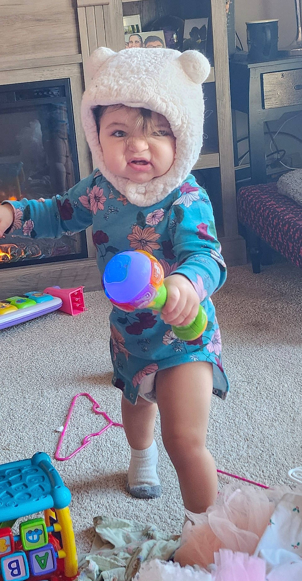 Novaleigh joined the competition — help win amazing prizes! baby_playing_with_toys, baby_toddler_clothing, cap, child, fun, happy, headwear, holiday, human_leg, leisure, party_supply, pattern, person, pink, play, sitting, sleeve, textile, thigh, toddler